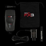 BaByliss Pro FX3 hair styling device with accessories on a black background
