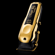 Gold and black Wahl Magic Clip cordless hair clipper on a black background Backwards Primos Barber Supplys