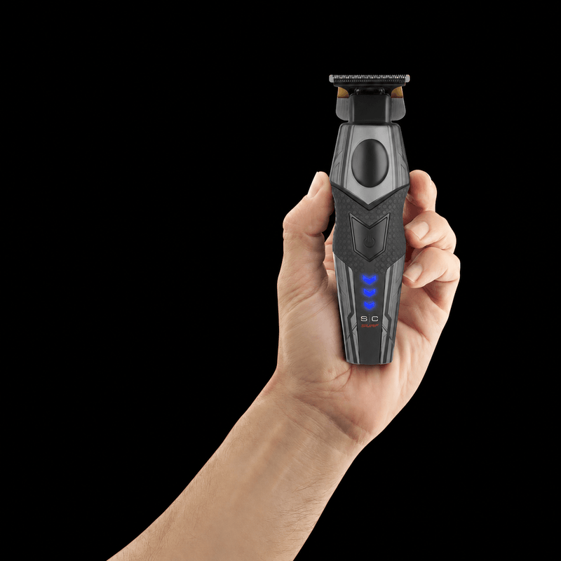 Hand holding the StyleCraft x 3Versince trimmer upright