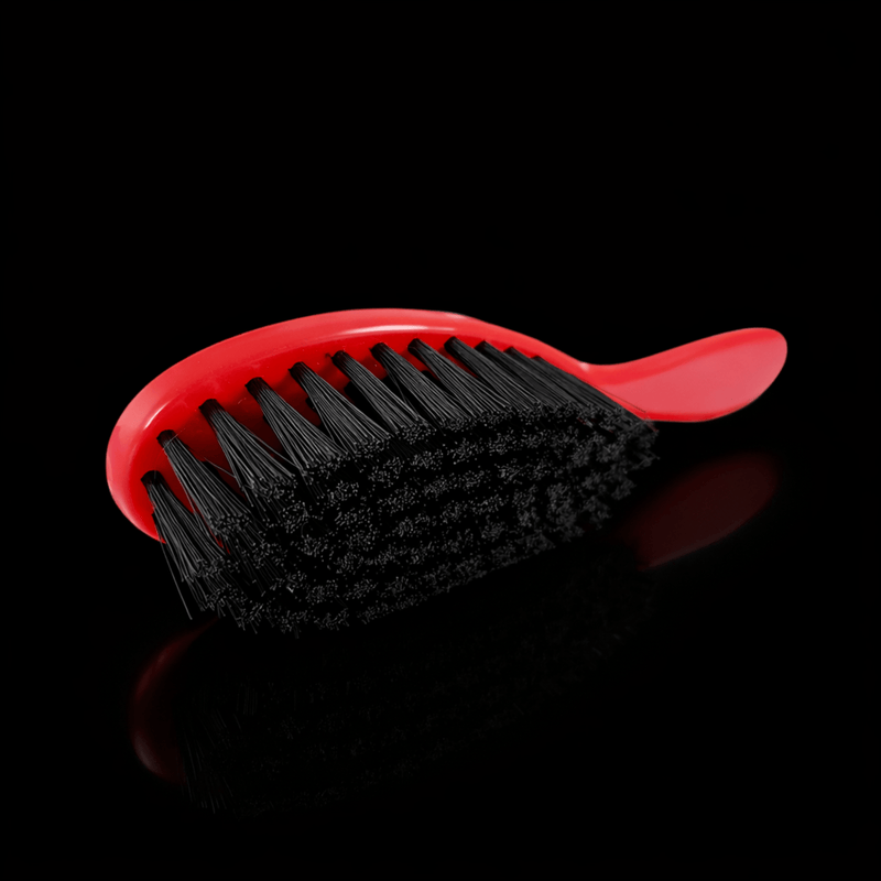 Red Stylecraft brush on a black background with slight shadow Primos Barber Supply