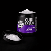 Jar of Curl Cream open with lid showing white product with visible brand logo on a black background 