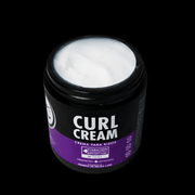 Top of jar showing white curl cream with visible logo on black background 