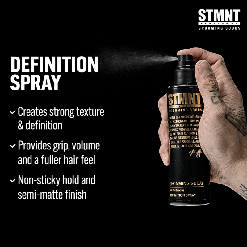 STMNT Grooming Goods Definition Spray being held with product details on a black background being sprayed Primos Barber Supply