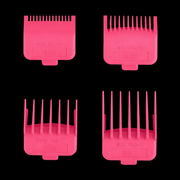 Gold Wahl hair clipper on a black stand with a black background