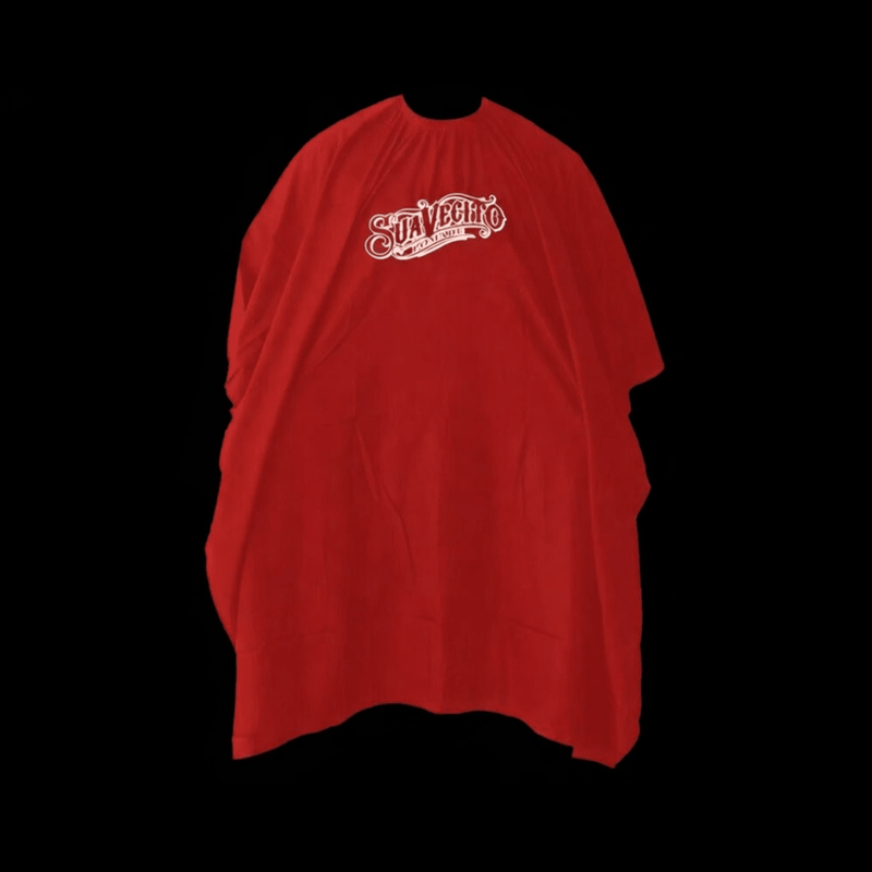 Red barber cape with 'Suavecito' logo on a black background Primos Barber Supply