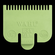 Green Wahl hair clipper comb on a black background