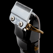 Hair clipper with blade on a black background