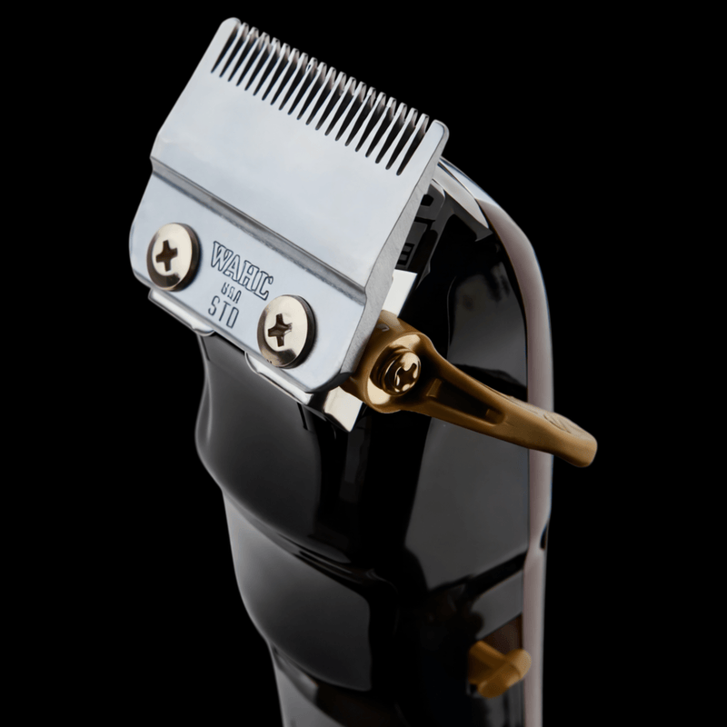 Hair clipper with blade on a black background