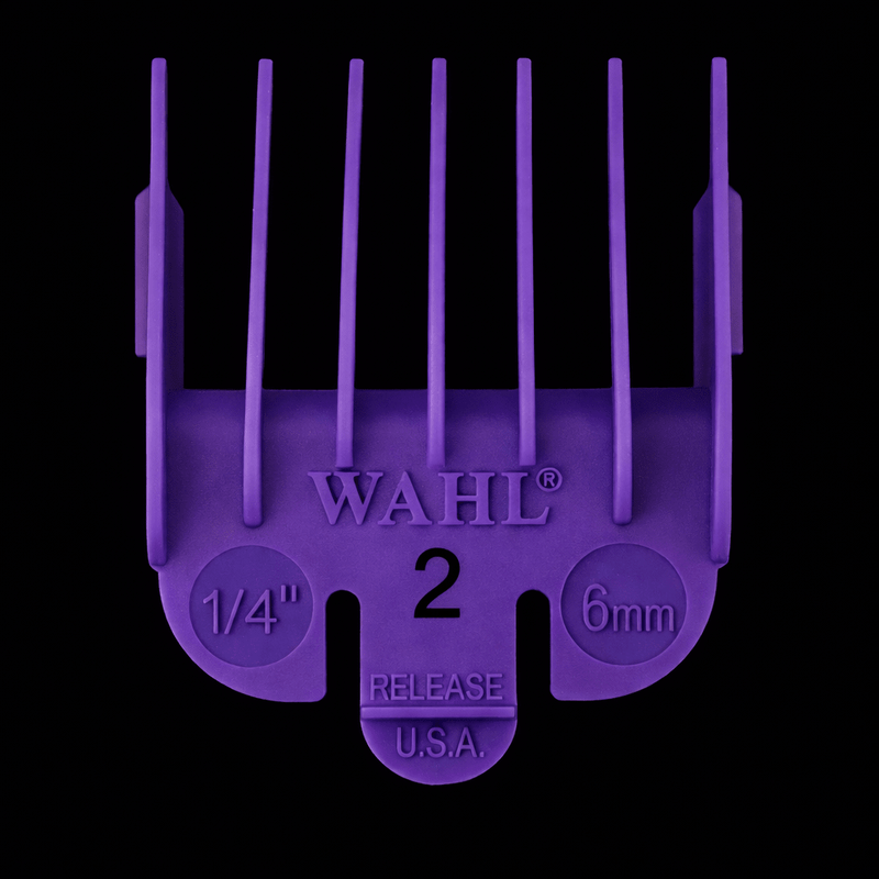 Purple Wahl hair clipper guide comb on a black background