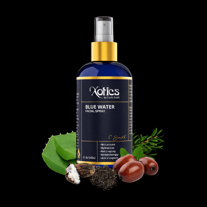 Xotic Blue Water Facial Spray bottle with natural elements on a black background