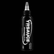 A bottle of Yrsauce Enhancer Black ink on a solid black background. The bottle is black with a white and silver label and a clear cap.