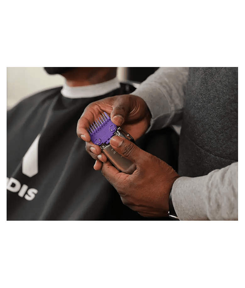 Andis Master Dual Magnet Comb Set – purple comb and clipper held by barber