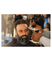 Andis Master Dual Magnet Comb Set – barber using guard on client in shop