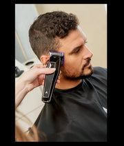 Andis RECON Clipper – professional barber using on client