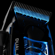 Close-up of BaBylissPRO Dual Coil Clipper FX95C black titanium MIM Space Blade with illuminated blue motor housing
