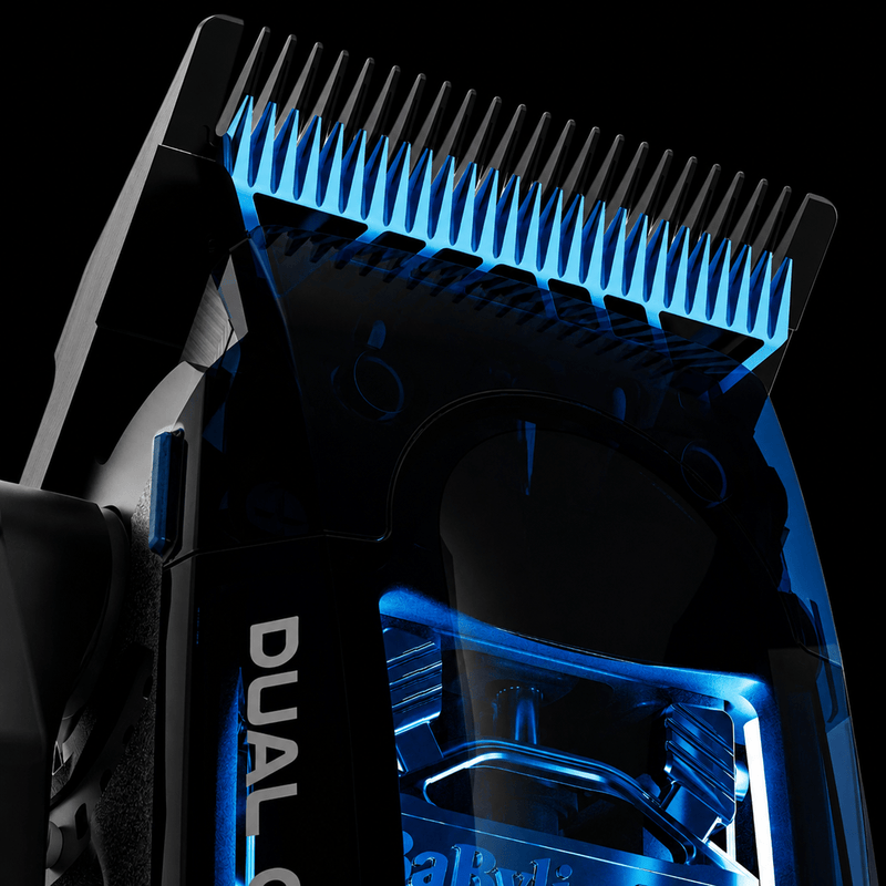 Close-up of BaBylissPRO Dual Coil Clipper FX95C black titanium MIM Space Blade with illuminated blue motor housing