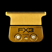 Gold FX3 hair clipper comb on a black background
