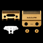 BaBylissPRO Gold Titanium Fade Blade FX8010G – clipper blade and accessories on black background
