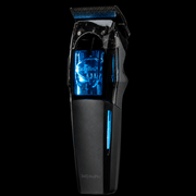 Side angle view of BaBylissPRO FX95T Dual Coil professional cordless trimmer with blue illuminated motor housing