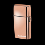 Side profile of the professional BaBylissPRO #FXFS2RG rose gold metal shaver housing and power switch.