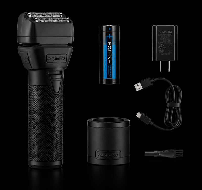 Black electric shaver with battery, charger, and accessories on a black background