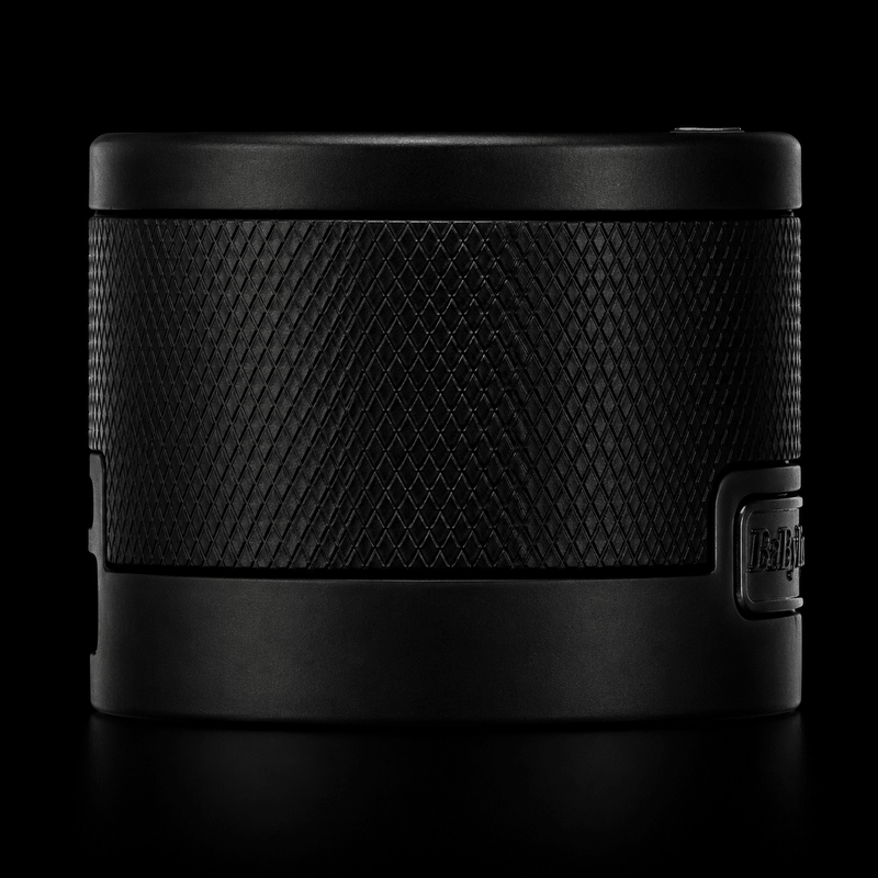 Black textured electronic device on a black background