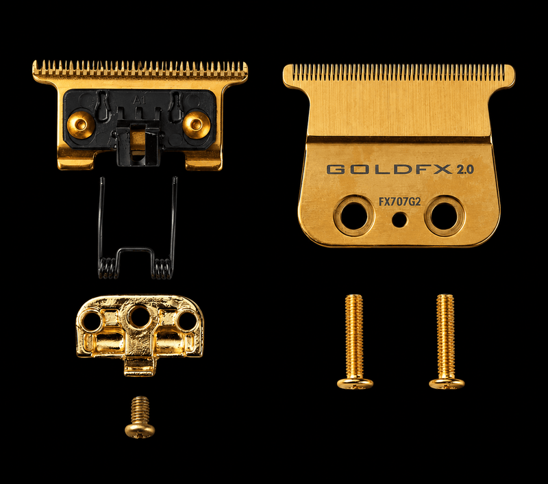 Gold FX hair clipper heads and parts on a black background