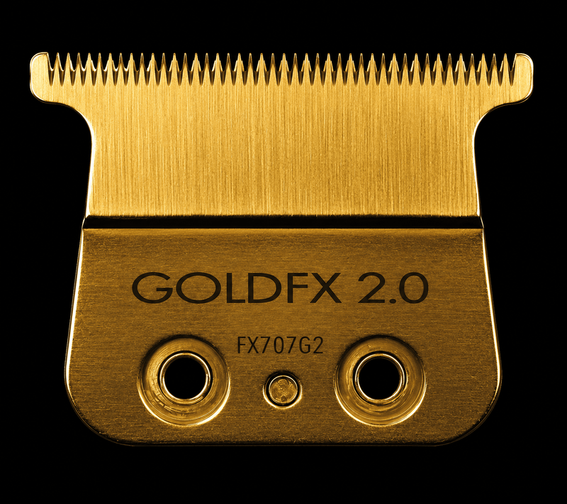 Gold hair clipper blade with 'GOLDFX 2.0' branding on a black background