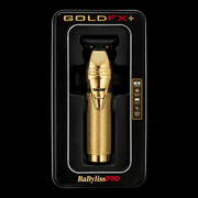Gold hair trimmer in packaging with 'BaBylissPRO' branding on a black background