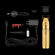 BaBylissPRO GoldFX Skeleton Trimmer FX787NG – full kit with attachments and accessories on black background