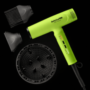 neon yellow hair dryer with attachments on a black background