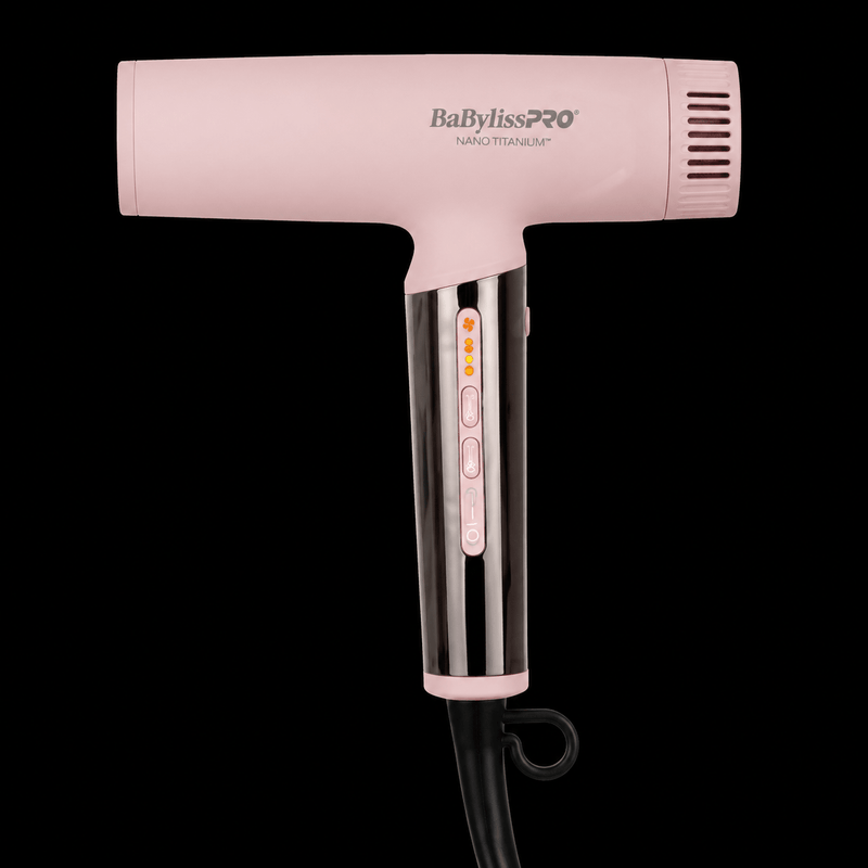 Pink BaBylissPRO hair dryer on a black background