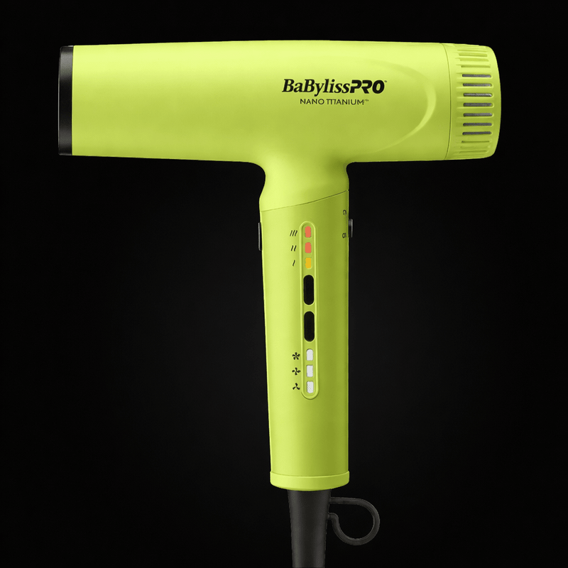 Yellow BaBylissPRO hair dryer on a black background