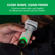 Barber with tattooed hand shaving a client's beard with the BaBylissPRO x Tomb45 white double-foil shaver