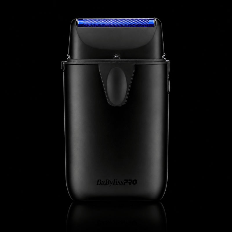Black electric shaver with blue light on a black background