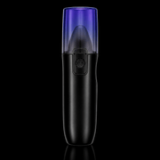 Black handheld device with a purple top on a black background