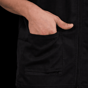 Black barber jacket pocket detail functional design for tools lightweight barber uniform Primos Barber Supply