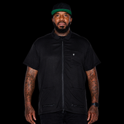 Barber wearing Barber Strong Barber Jacket Black at barbershop