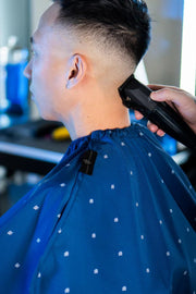 Barber Strong Shield Collection blue barber cape neck closure detail