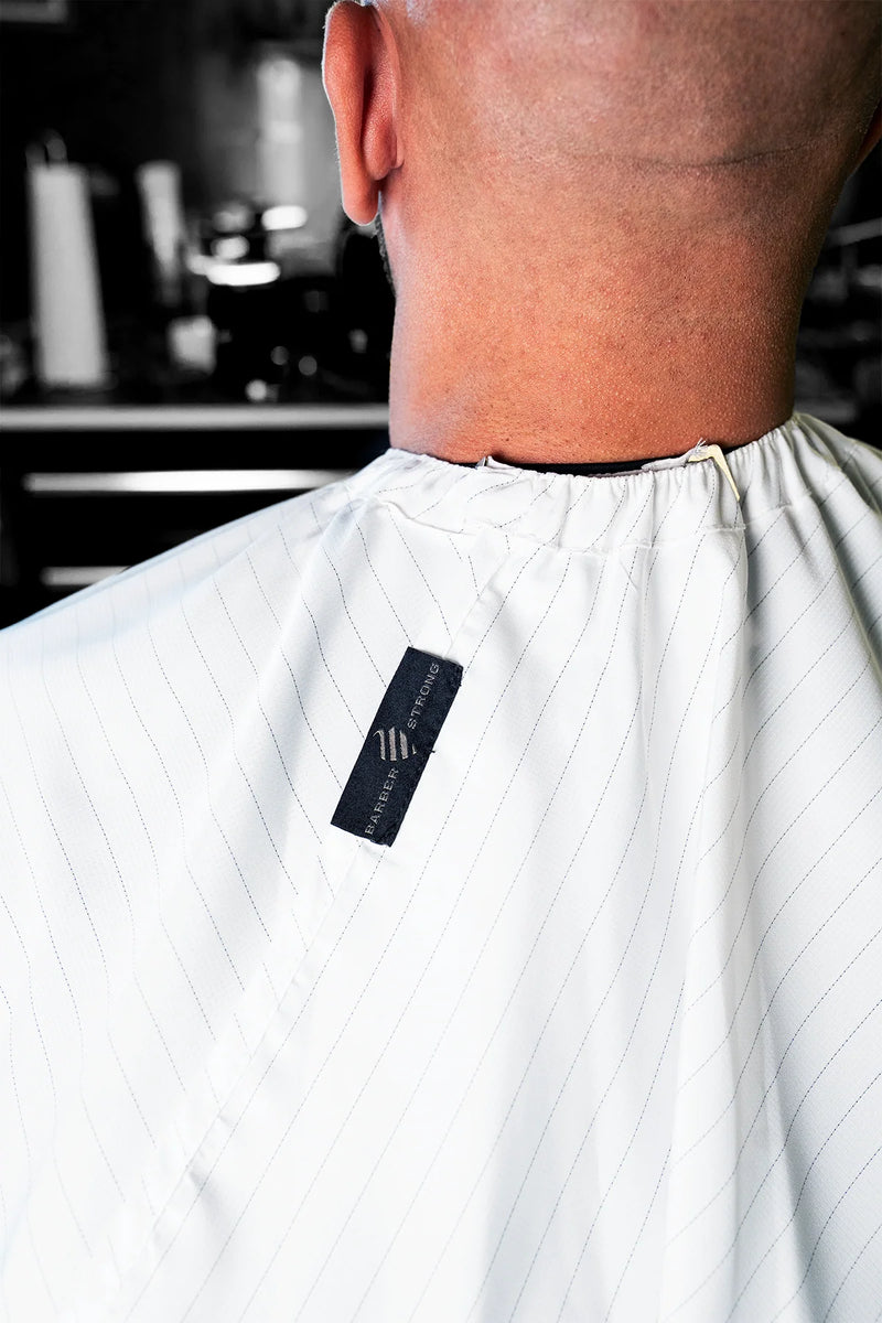 barber strong White barber cape neck closure detail at primos barber supply