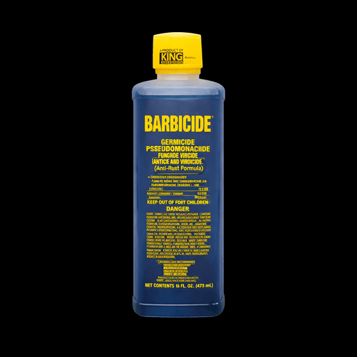 Barbicide bottle with yellow cap on a black background