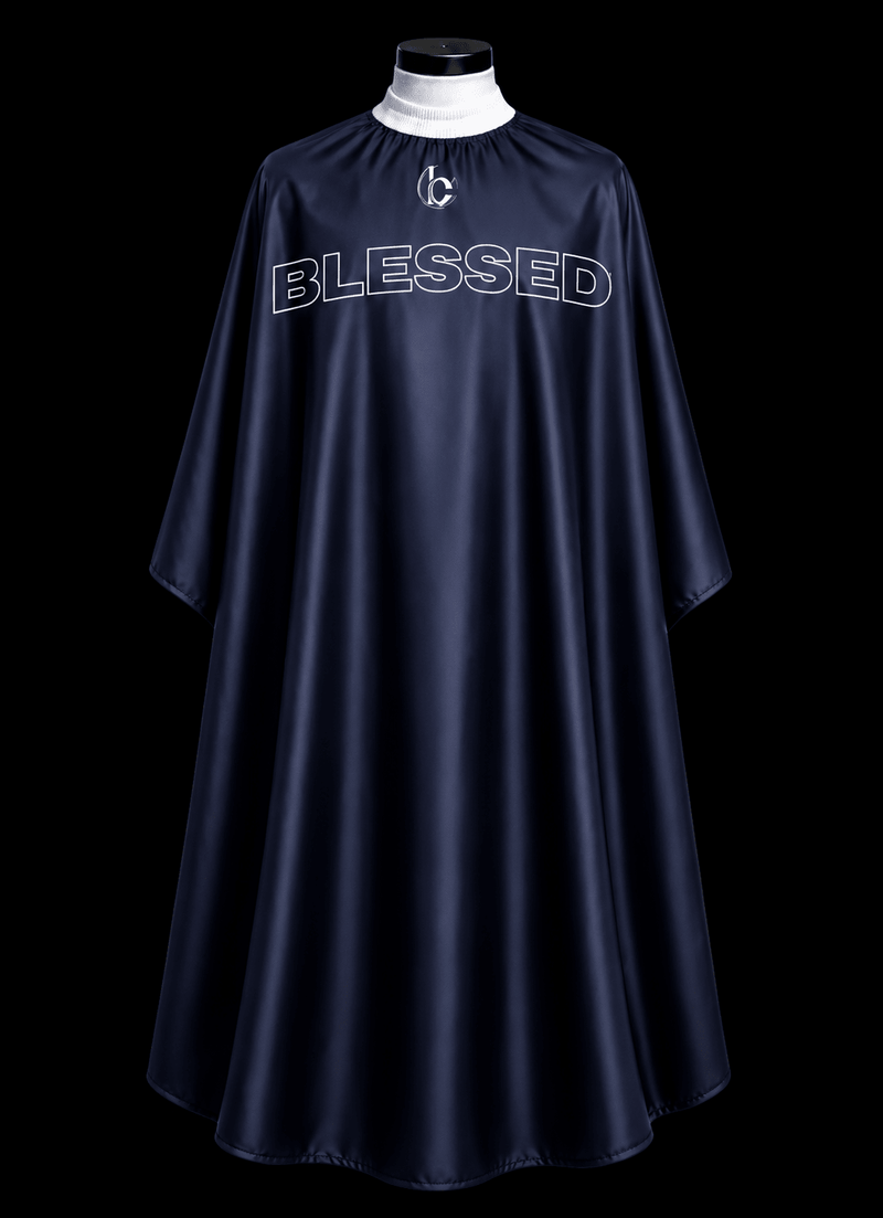 Blessed Capes Midnight barber cape in a deep navy blue color featuring lightweight water-resistant material and full professional coverage for barbers and stylists.