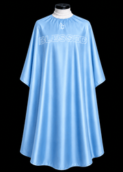 Blessed Capes Powder barber cape in a soft powder blue color featuring lightweight water-resistant material and full professional coverage for barbers and stylists.
