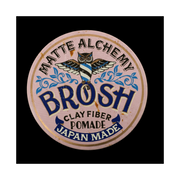 Brosh Clay Fiber Pomade Matte Alchemy Pink – lid top view with owl logo on black background