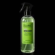 Clear spray bottle with green label on a black background