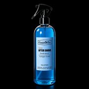 Blue bottle of Champkom after shave with a black spray nozzle on a black background