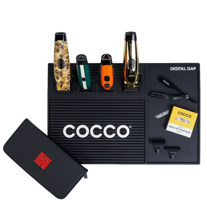 COCCO barber station mat with professional clippers, trimmers, razor, combs, and barber tools organized on a workstation.