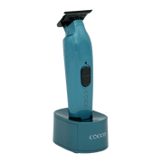 Blue hair trimmer with charging stand on a transparent background
