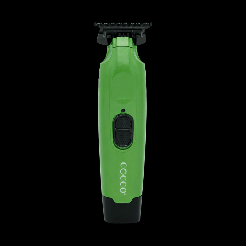 Green and black COCCO grooming tool on a white background