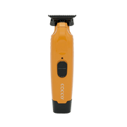 Orange and black grooming clipper with 'COCCO' branding on a transparent background